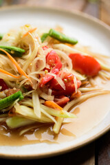 Thai food, Spicy papaya salad (Som Tum) on plate, Close up