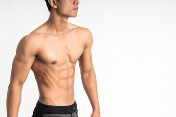 sexy man showing muscular abdominal stand facing side on isolated background