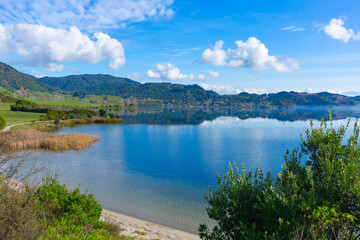 View across Lake Okareka to small lakeside village