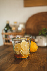 a jar of honey and lemon. the lemon is very yellow and the honey looks very creamy and delicious. honey lemon is best drunk during a cold or when one has a sour throught, its very delicious.