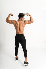Obraz premium full body image of young man showing muscular body stand facing back on isolated background