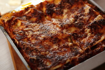 Freshly baked lasagna in baking pan. Making Lasagna Bolognese Series.