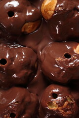 Cream puff pastry decorated chocolate icing. Directly Above.