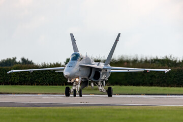 Fototapeta premium Multirole strike fighter aircraft lining up on a runway.