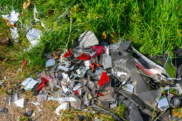 Car or motorcycle crash. A pile of debris on the roadside. 