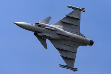 Fototapeta na wymiar Military jet turning at high speed.