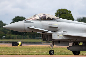 Modern advanced fighter aircraft taxiing at an airbase.