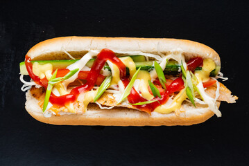 hot dog on the black background