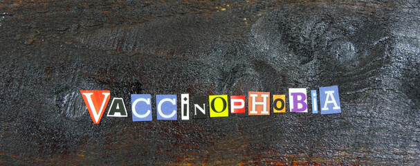 Fototapeta na wymiar Vaccinophobia word made of paper letters, fear of vaccines and injections 