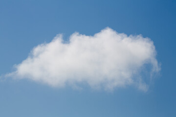 pure white fluffy cloud in blue sky