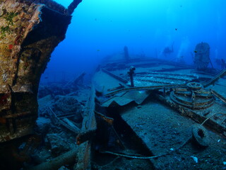 ship wreck underwater scuba divers to search and explore ocean bottom scenery of metal underwater