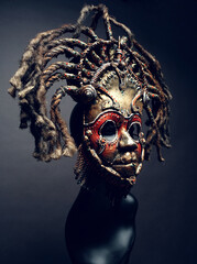 Creative african mask, dark studio background