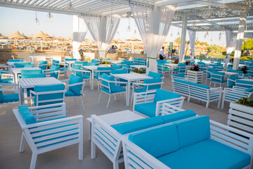 Fototapeta na wymiar chairs and tables in a beach restaurant