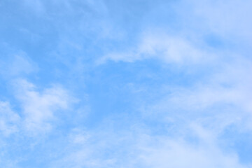 Obraz premium Bright Blue sky with white cloud. Beautiful sky background and wallpaper. Clear day and good weather in the morning. 