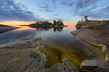 Rocky shore of the orthern lake at dawn, lake Ladoga