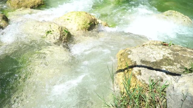 river and waterfalls of the Elsa river in the Colle Val d'Elsa river park. siena tuscany italy.