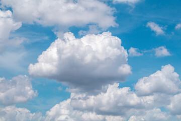 Deep blue sky and white cloud background.