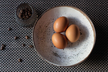 eggs in a bowl on wooden table