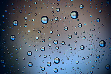 fresh drops background blue glass / wet rainy background, water drops transparent glass blue