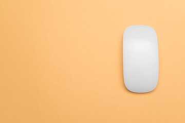 Modern computer mouse on color background