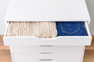 Modern chest of drawers in room