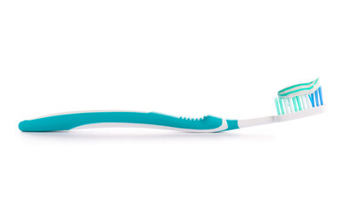 Tooth brush with paste on white background