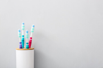 Tooth brushes on grey background