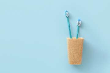 Tooth brushes on color background