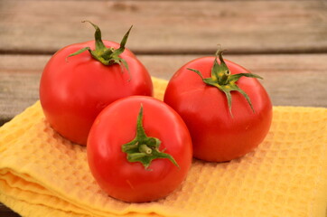 red tomatoes on a wooden table