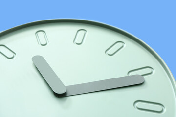 Simple clock on color background, closeup
