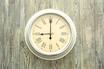 Fototapeta na wymiar Simple clock on wooden background