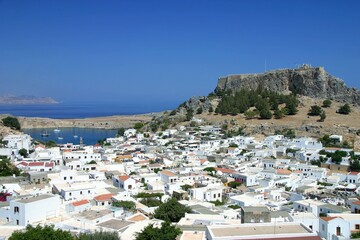 Fototapeta na wymiar Panoramic View of Beautiful Lindos Village with the Acropolis