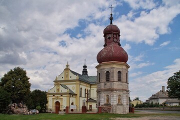 Fototapeta na wymiar belfry and the Catholic church in Lanieta, Poland