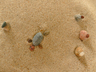 symbolic picture of helplessness with stones in sand