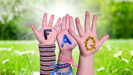 Children Hands Building Colorful English Word FAQ. Sunny Green Grass Meadow As Background