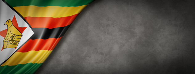 Zimbabwe flag on concrete wall banner - obrazy, fototapety, plakaty