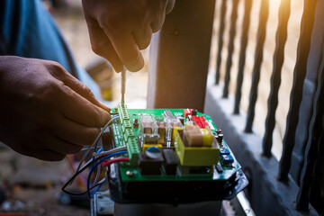 A Technician assembling motor system and testing motor automatic gate by screwdriver home security...