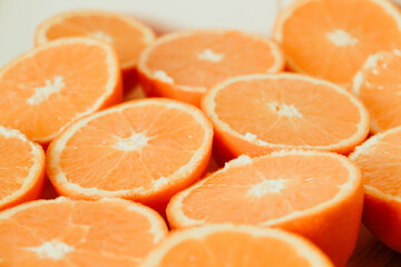 Bunch of fresh sliced oranges on a tray
