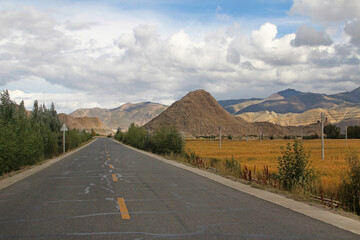 Autumn view of highway road running through mountains, Tibet, China