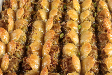 Traditional Dessert Turkish Baklava. Walnut, Pistachio Turkish Style Antep Baklava Presentation. Baklava from Turkish cuisine.