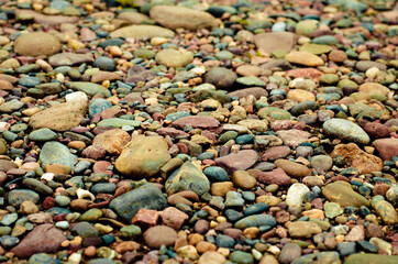 Background of colored stones. Sea pebbles. pebbles on the ground