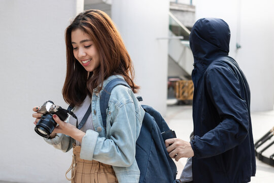 Pickpocket Thief Stealing Wallet From Backpack Of Tourist Asian Girl