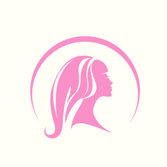 Hair salon and beauty studio logo.Woman with long, wavy hairstyle.Profile view girl portrait silhouette.Bright pink color.Cosmetics and spa icon isolated on light background.