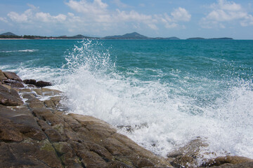 waves crashing on rocks