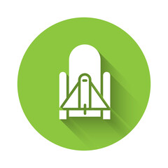 White Rocket launch from the spaceport icon isolated with long shadow. Launch rocket in space. Green circle button. Vector Illustration.