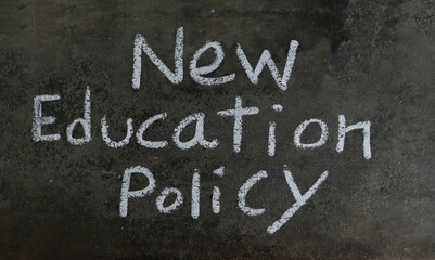 Fototapeta premium New Education Policy Phrase Written On Blackboard With White Chalk