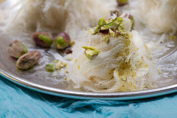 Turkish cotton candy - pishmanie with pistachios. Selective focus