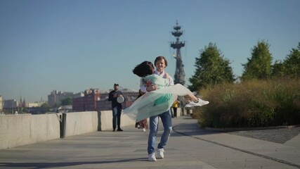 Dancers are dancing a Spanish dance on the river embankment. Street musicians and dancers.