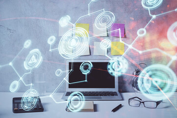 Computer on desktop with social network hologram. Double exposure. Concept of international people connections.