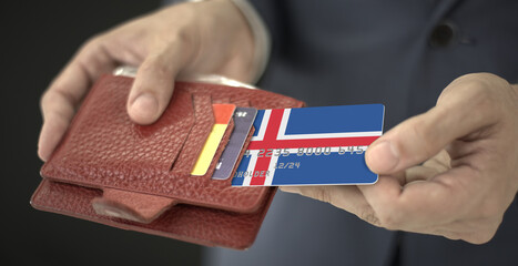 Man pulls credit card with flag of Iceland out of his wallet, fictional card number